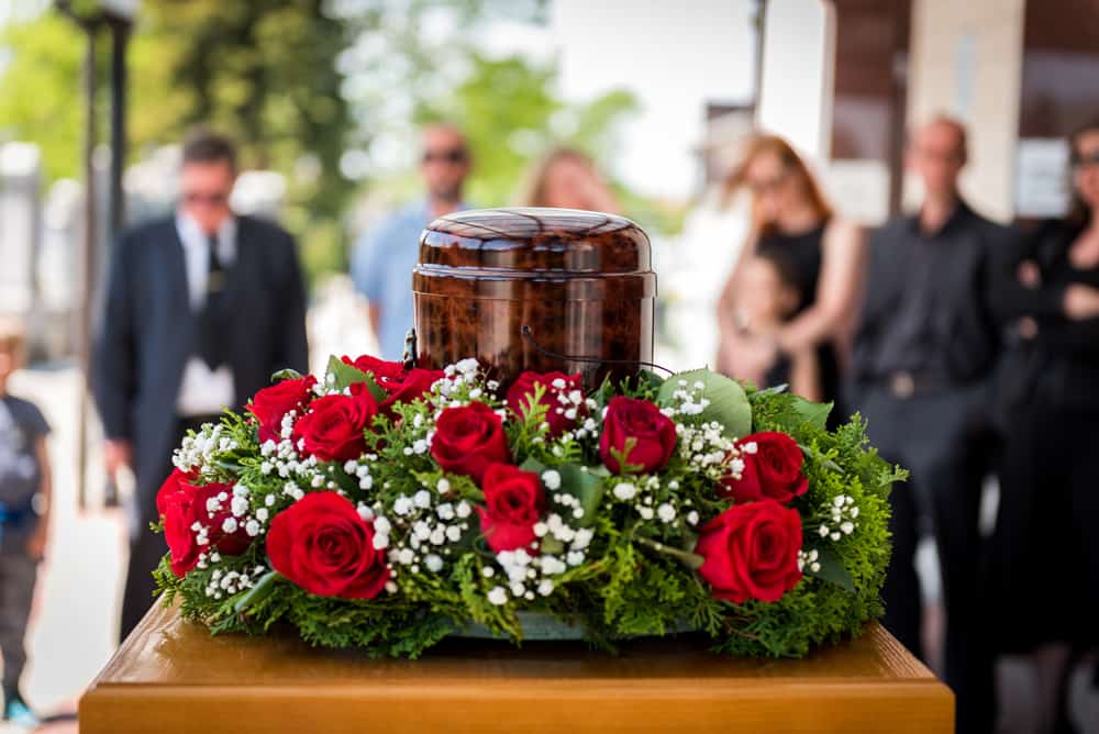 flowers and urn at funeral
