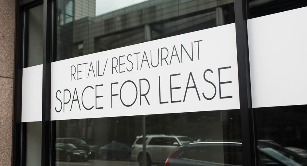 building with sign for lease